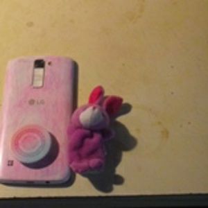 A phone and littel toy came with it